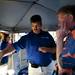 DTE Energy vendor Todd Bondy explains the differences in light bulbs during the Mayor's Green Fair on Friday, June 14. Daniel Brenner I AnnArbor.com